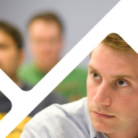 Image: Detail of a brochure cover design with a photo of students inside a geometric design.