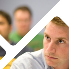 Image: Detail of a brochure cover design with a photo of students inside a geometric design.